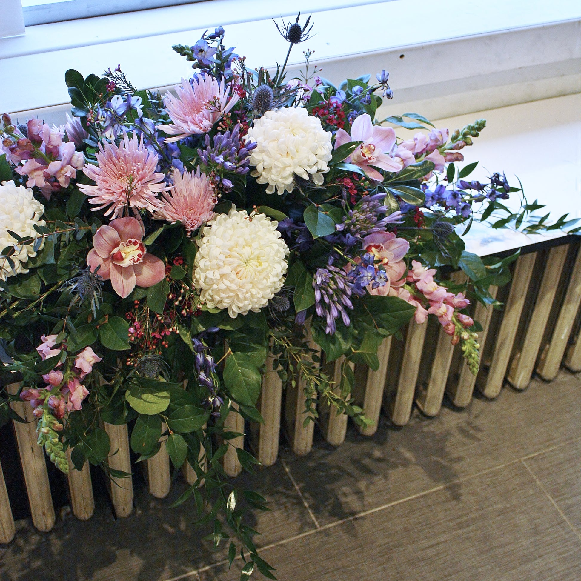 casket spray oleander floral design toronto same day flower delivery sympathy funeral etobicoke white and green flowers orchid rose eucalyptus ruscus snapdragons chrysanthemums