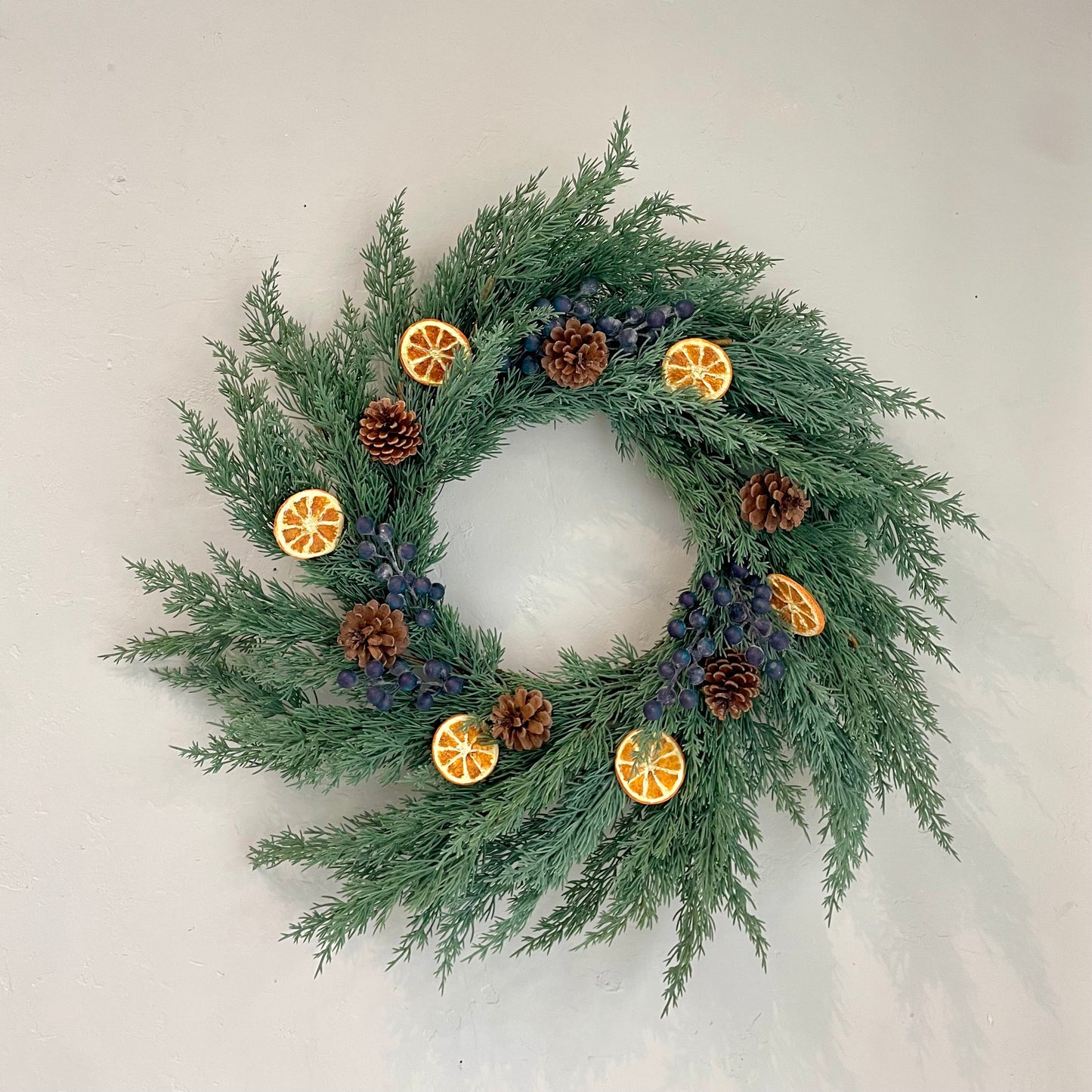 24" Blue Star Juniper Wreath with Fruit and Pinecones